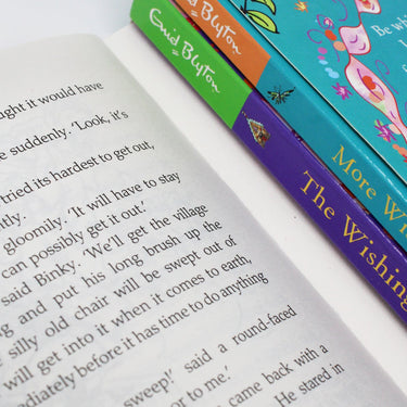 Photo of The Wishing Chair 3 Books Collection Pages by Enid Blyton on a White Background